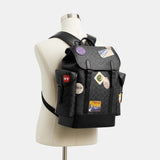 CBF04-Hitch Backpack In Signature Canvas With Patches-Charcoal Multi