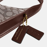 CBH25-Curve Zip Bag In Signature Jacquard-B4/Oak Maple