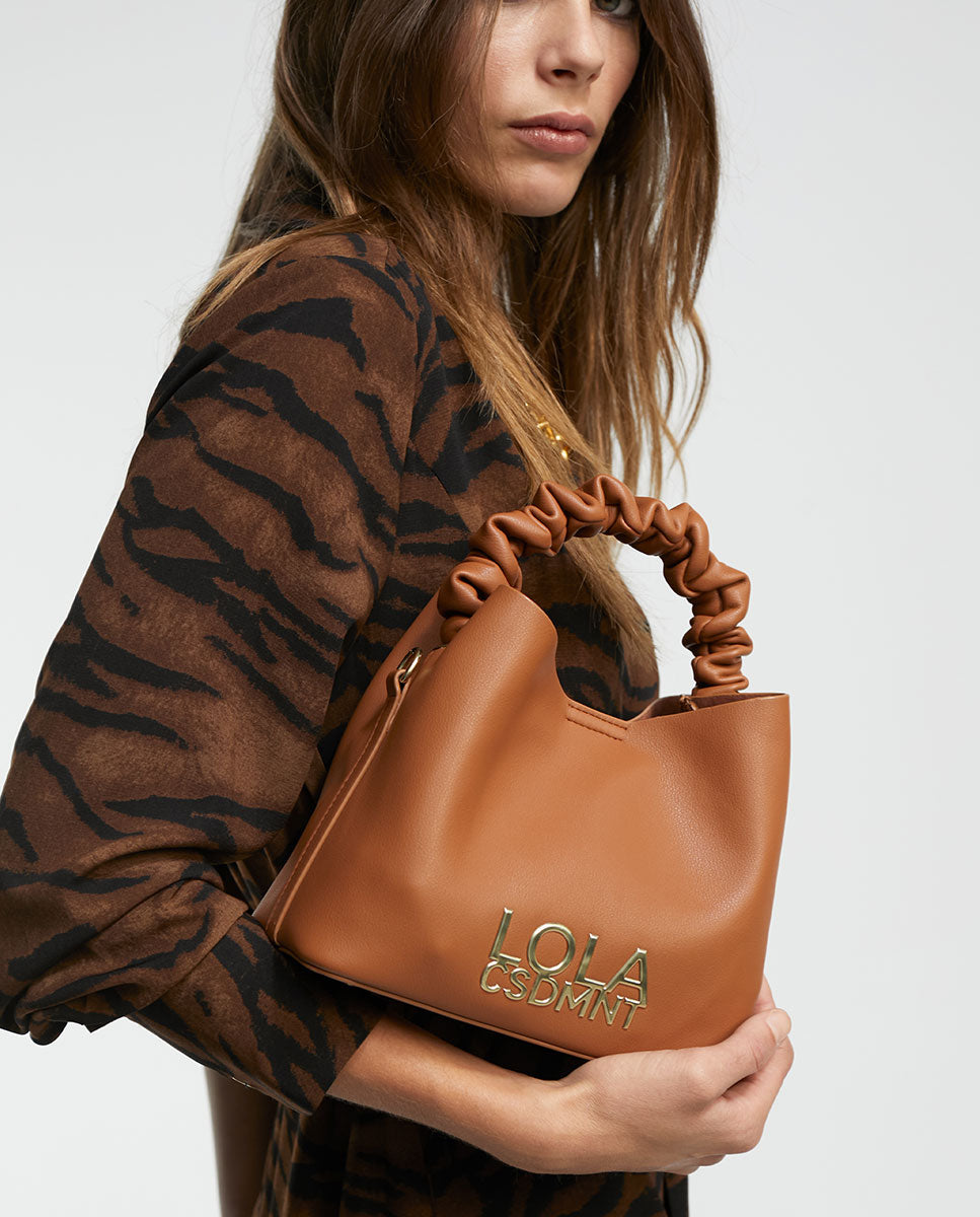 Crossbody bag with gathered strap