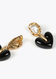 Gold-toned earrings with black heart