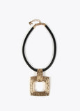 Gold-toned necklace with a black cord.