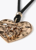 Necklace with gold-toned heart pendant