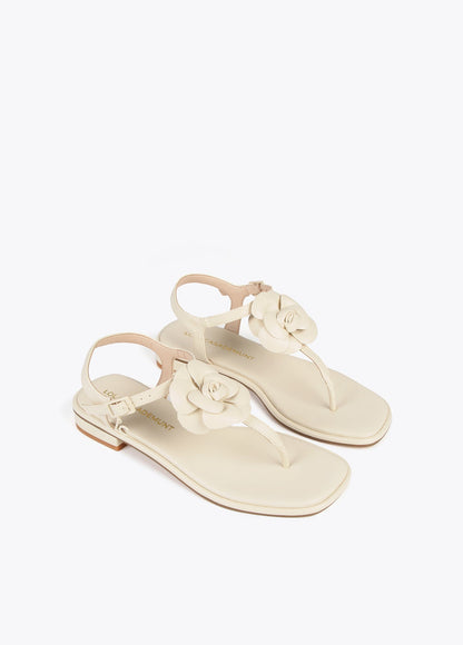 Sandals with toe dividers and flower detail