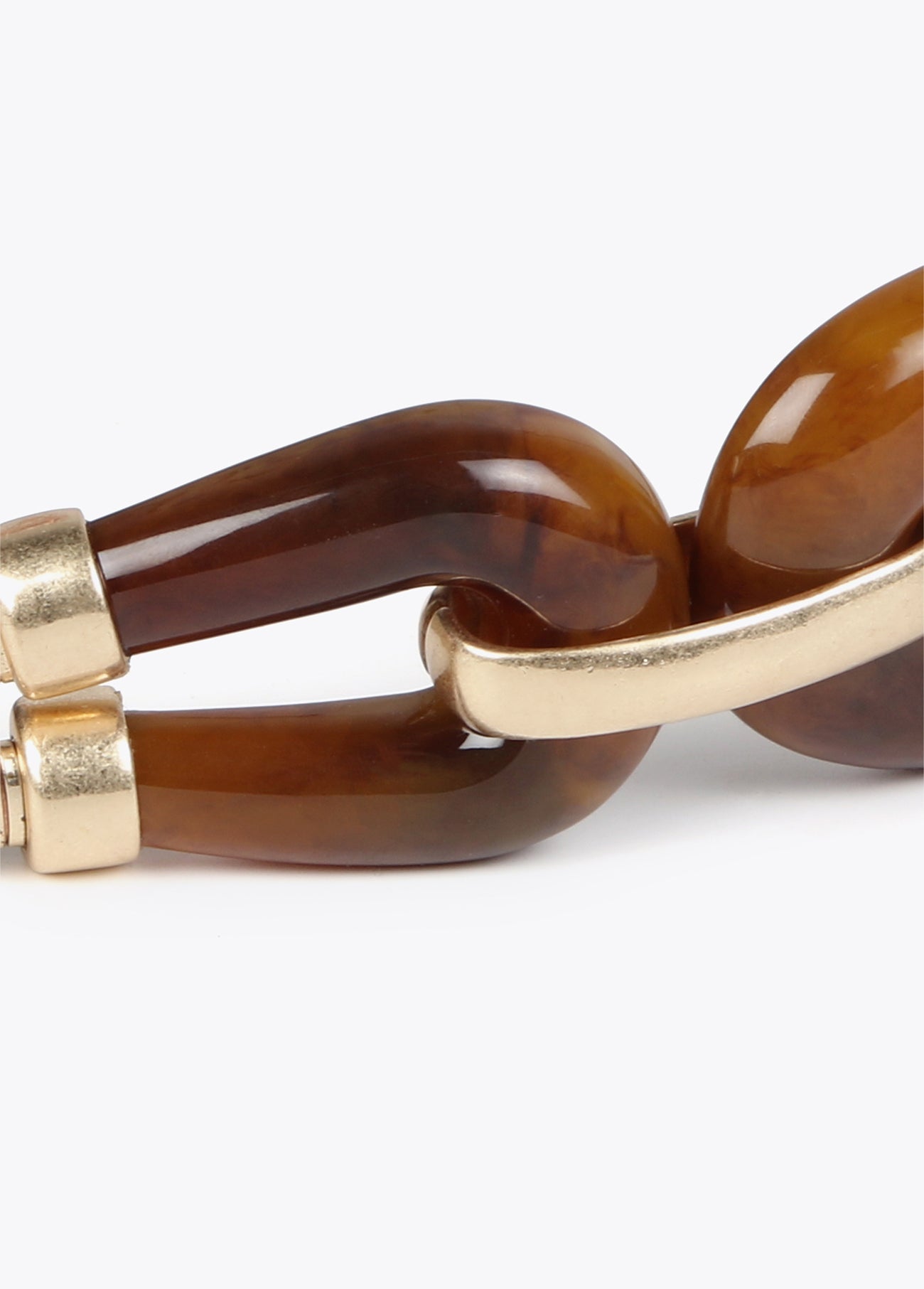 Stretch metal belt with tortoiseshell pieces