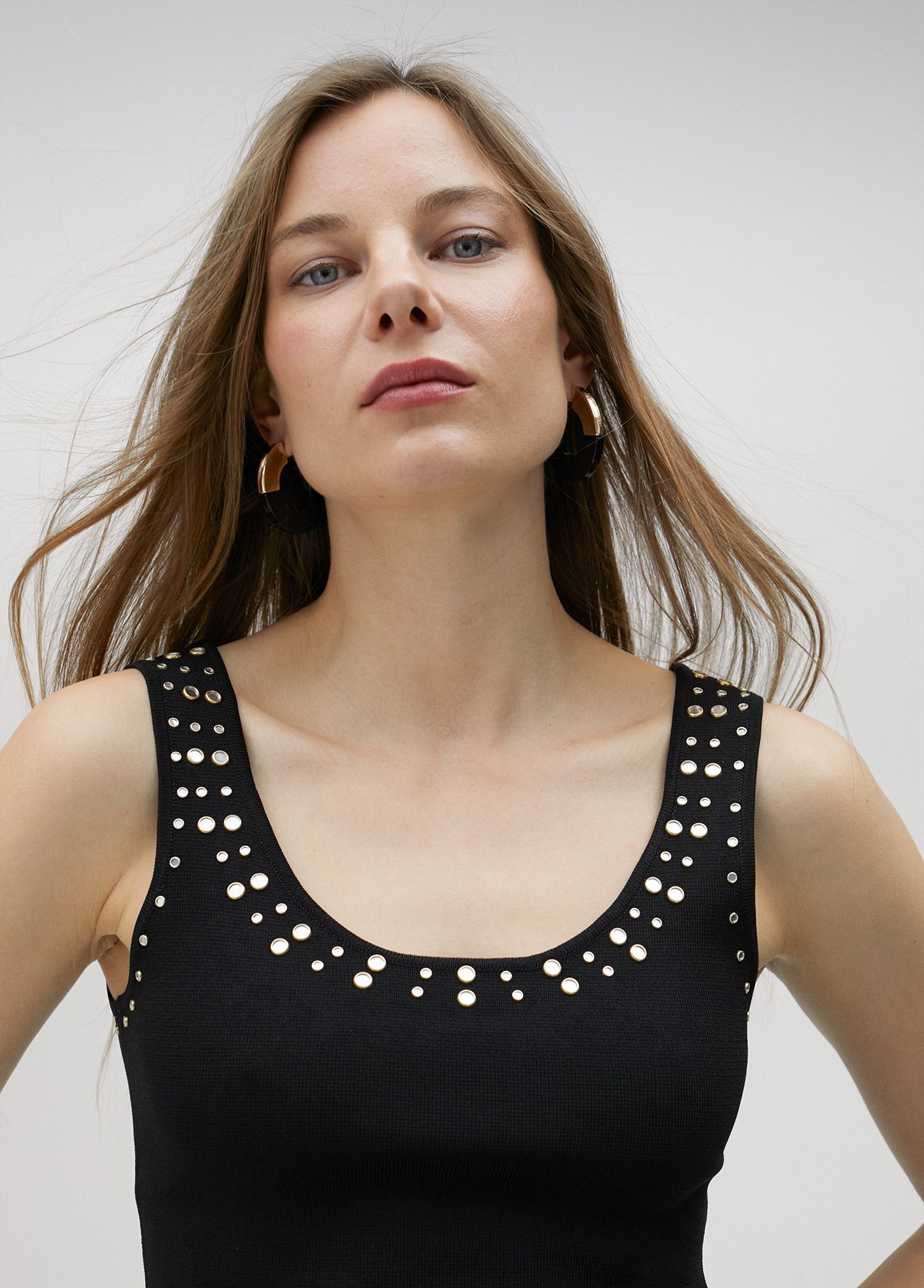 Knit top with rhinestone neckline