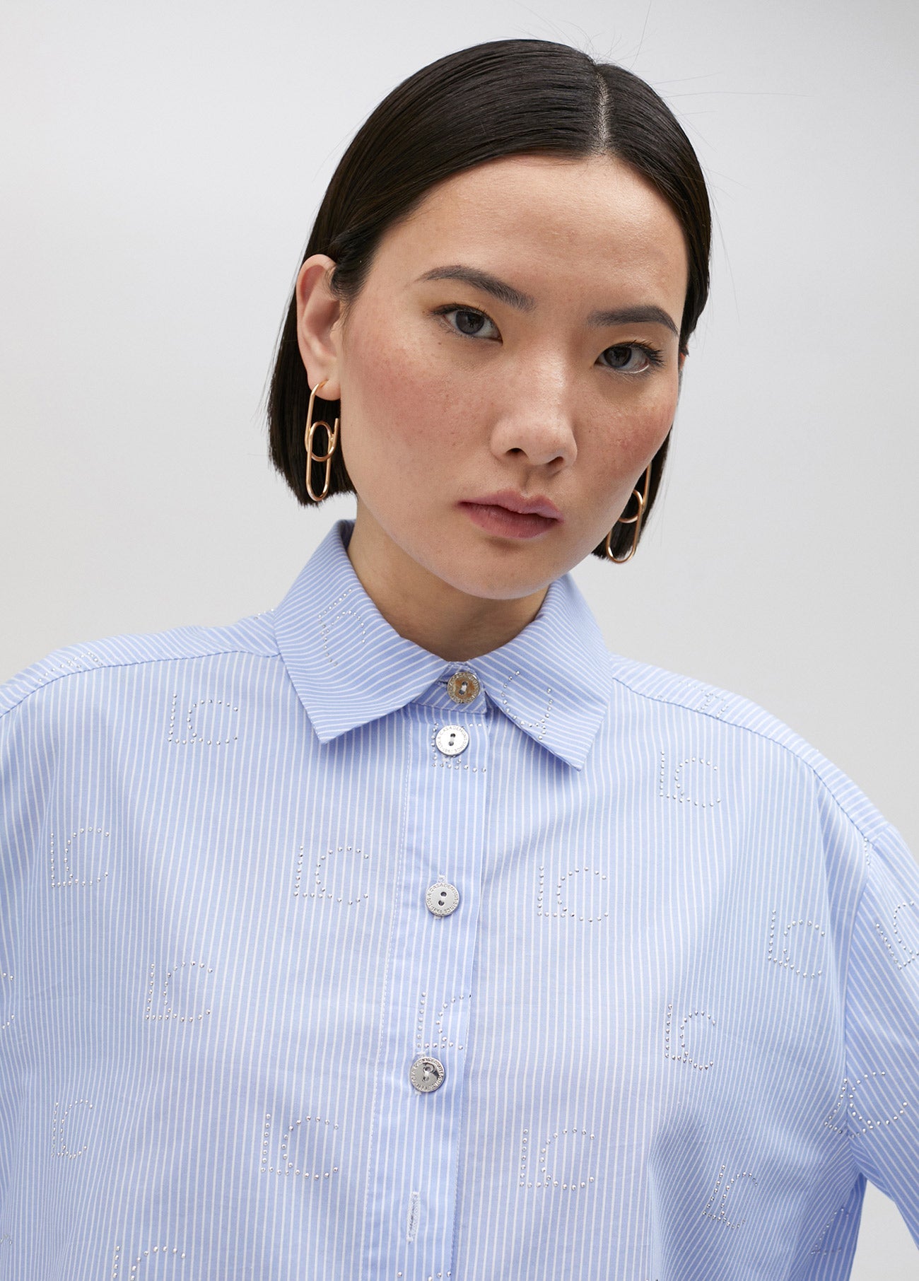 Striped shirt with rhinestone logo