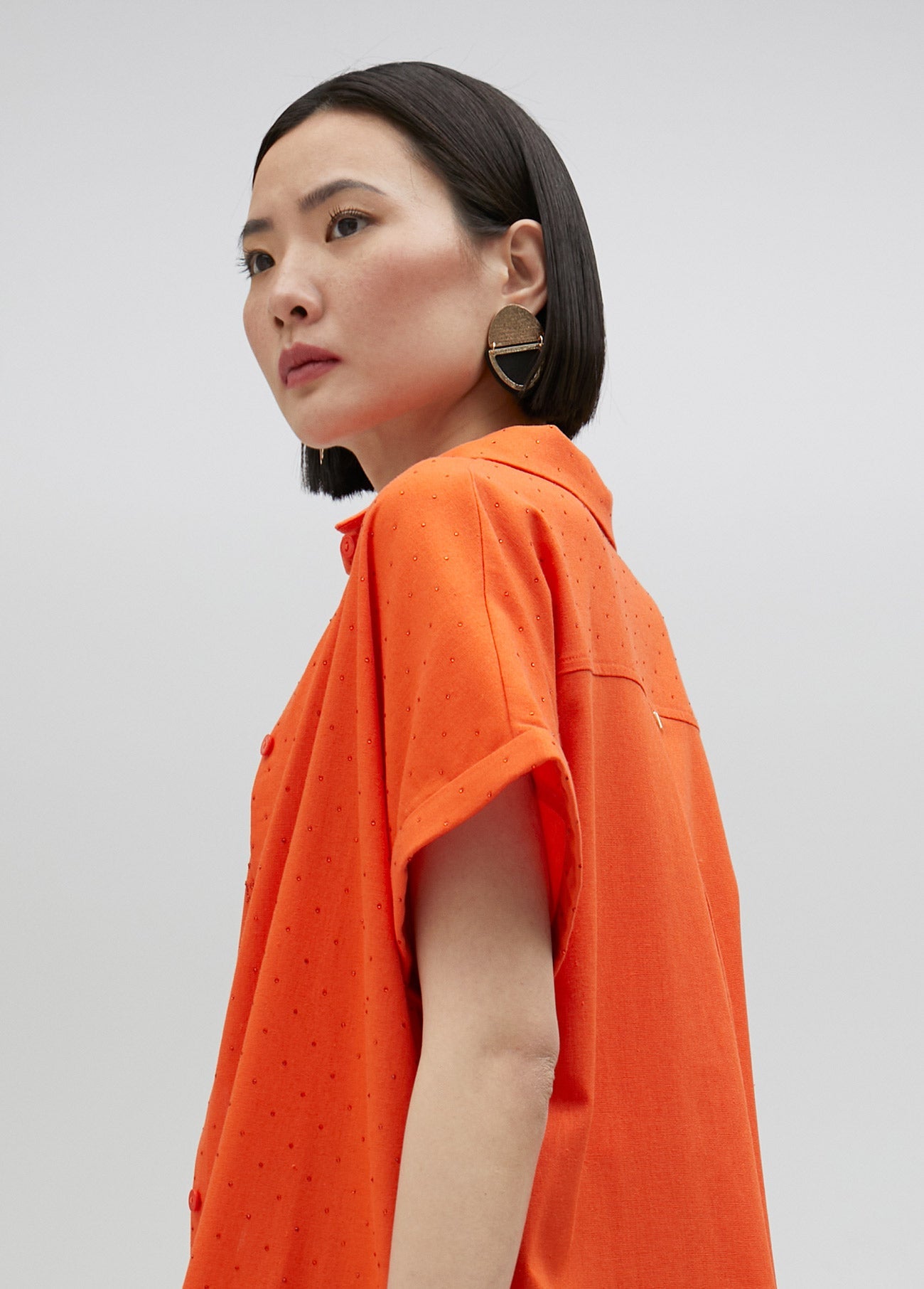 Long oversize blouse with rhinestone detail