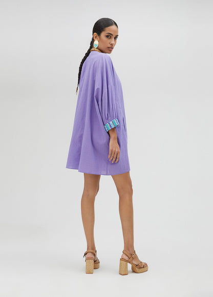V-neck blouse with neckline and cuff details