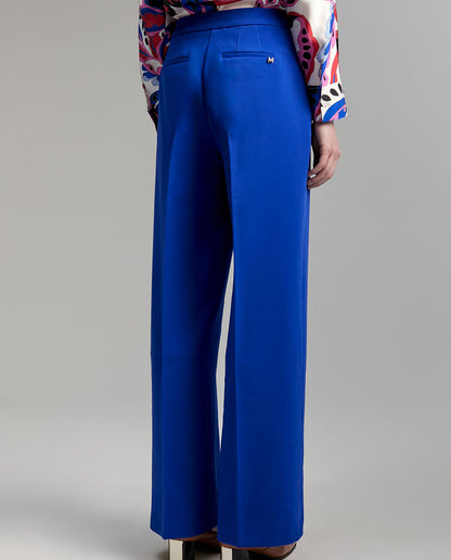 Trousers with snap buttons