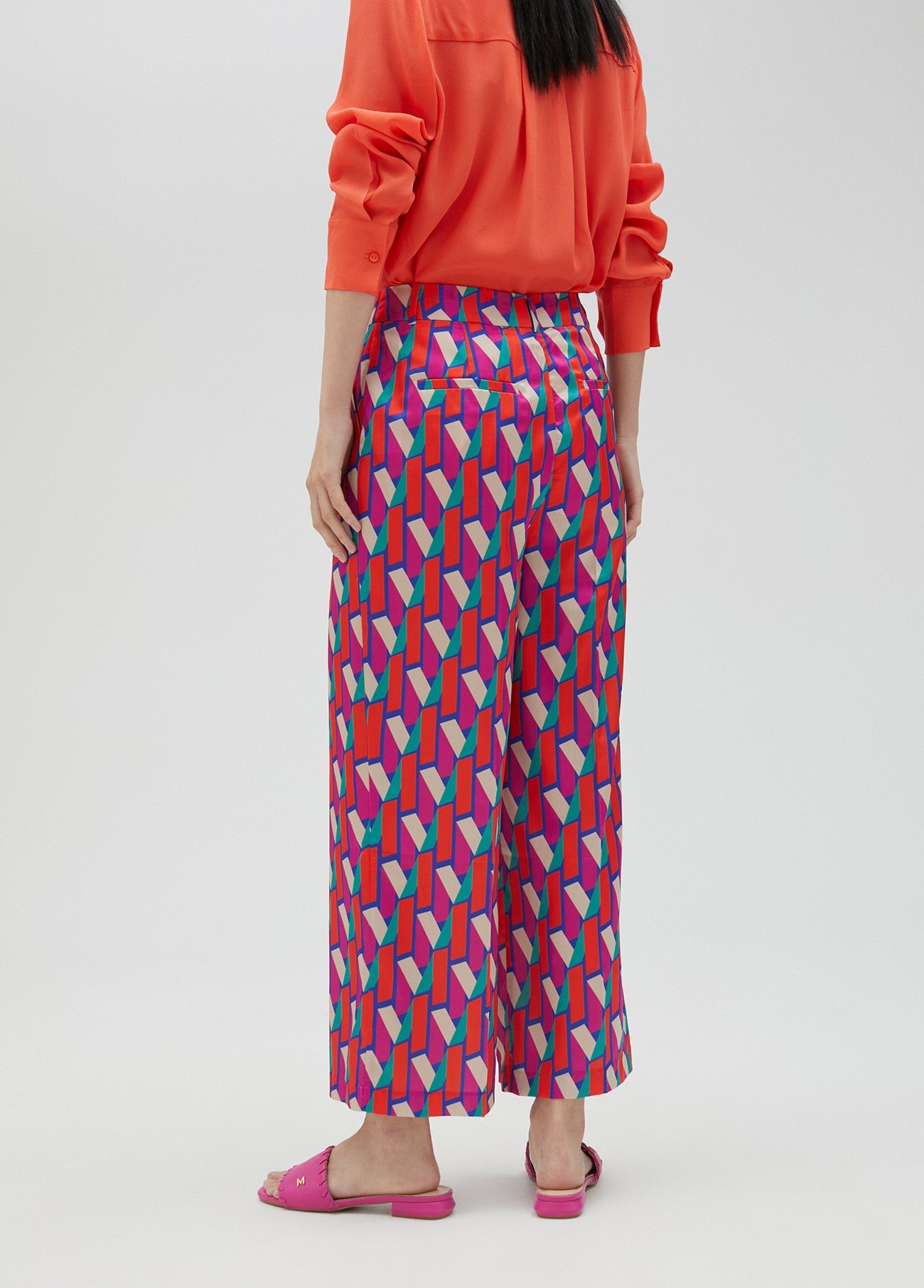 Palazzo trousers in multicoloured logo print
