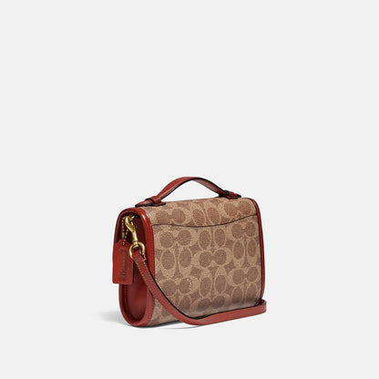 Kip Turnlock Crossbody In Signature Canvas - COACH Saudi Arabia Official Site