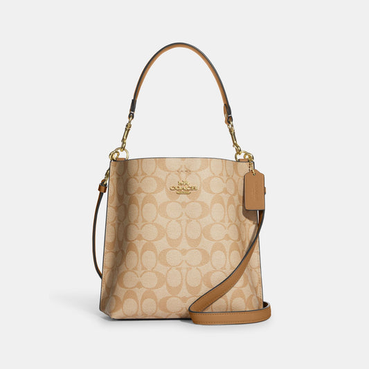 CA582-Mollie Bucket Bag 22 In Signature Canvas-IM/Lt Khaki/Lt Saddle