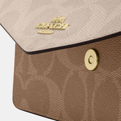 Klare Envelope Crossbody Bag In Blocked Signature Canvas