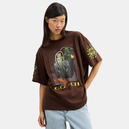 CCA91-Coach Graphic Relaxed T-Shirt In Organic Cotton-Brown